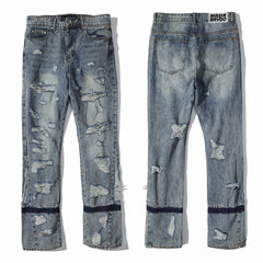 Who Decides War All‑Over Ripped Light Wash Stacked Flare Jeans