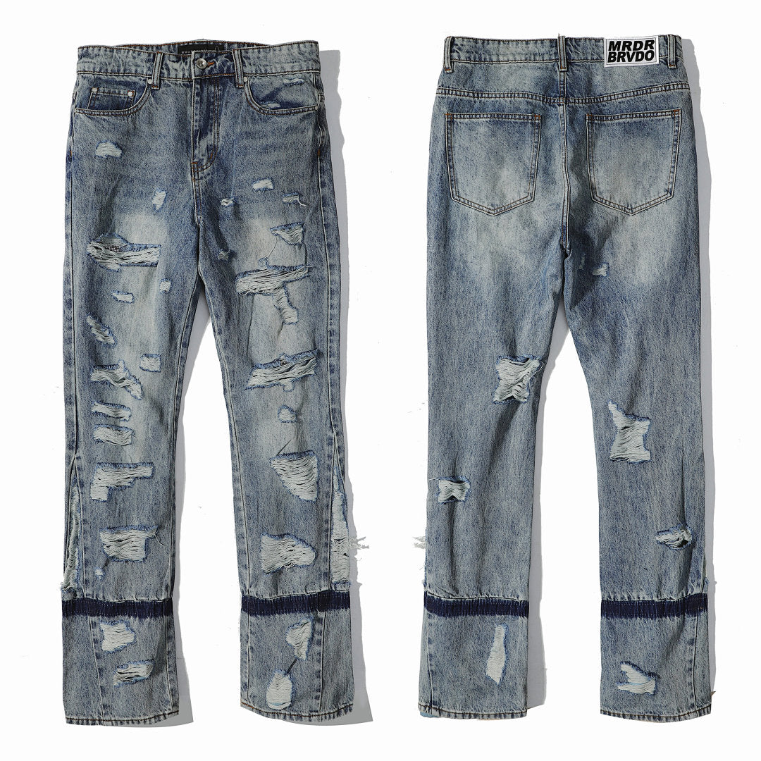 Who Decides War All‑Over Ripped Light Wash Stacked Flare Jeans