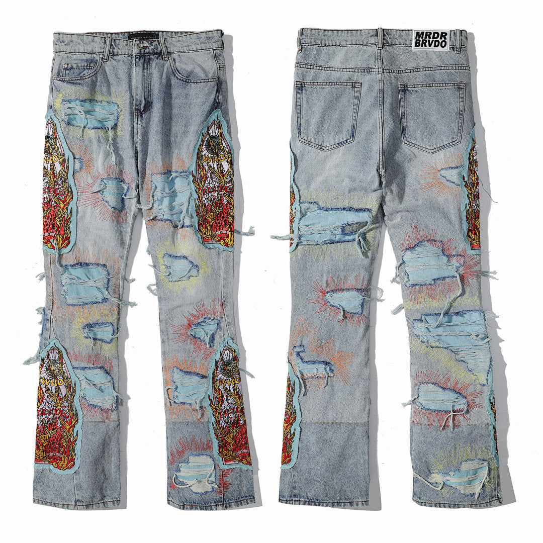 Who Decides War Multi‑Patch Ripped Distressed Light Wash Stacked Flare Jeans