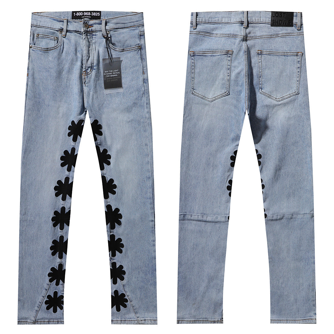 LOST SHDWS LIGHT WASH BLACK FLORAL APPLIQUE STACKED FLARE JEANS